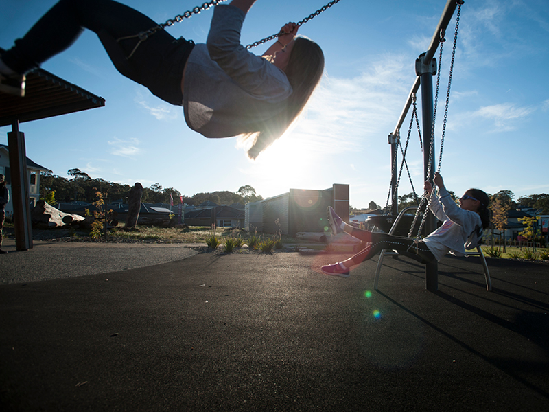 Springlake playgrounds with children on swings